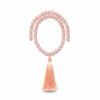 Minimal coral pink mala necklace with blush gemstone beads centered on white background