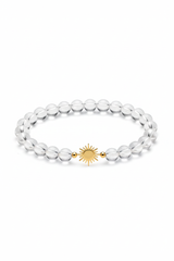 Luxury spiritual crystal quartz bracelet with gold sun charm, centered on white background