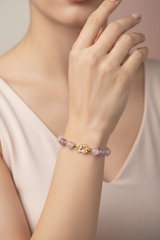 Elegant female model wearing Harmony Stone Bracelet natural rose gemstone bracelet on wrist
